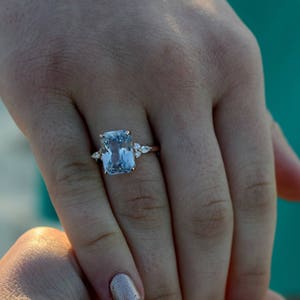 18k White Gold Engagement Ring: 4ct Emerald Cut Light Blue Sapphire