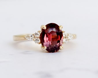 Red sapphire ring. Oval red 2ct sapphire engagement ring. Yellow gold sapphire and diamond ring. Cluster engagement ring by Eidelprecious