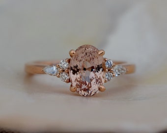 Peach sapphire engagement ring. Sapphire diamond ring rose gold. Oval sapphire cluster ring. Campari engagement ring by Eidelprecious