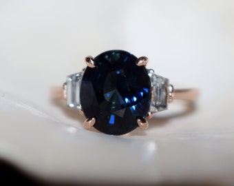 Jet Blue Ice Sapphire Engagement Ring. Rose gold ring. Diamond ring. Oval cut deep blue sapphire ring. Ice collection by Eidelprecious