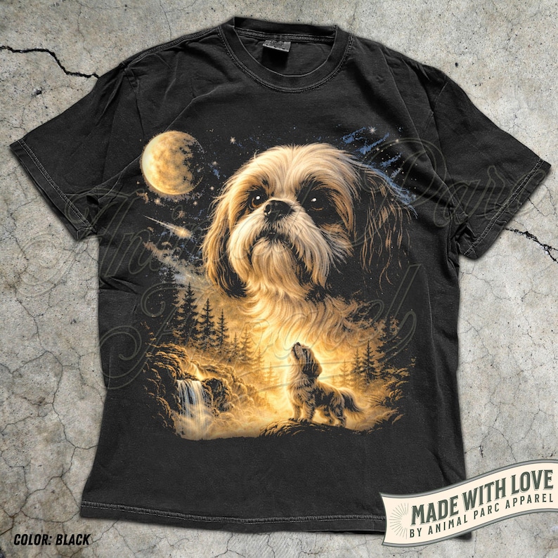 May include: Black t-shirt featuring a detailed illustration of a Shih Tzu dog under a starry night sky with a full moon. The design includes a waterfall and forest scene. The text "MADE WITH LOVE" is visible.