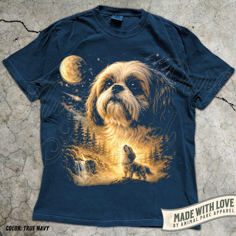 May include: True navy blue t-shirt featuring a detailed illustration of a Shih Tzu dog under a full moon and starry night sky. The design includes a waterfall and forest scene. The text "MADE WITH LOVE BY ANIMAL PARC APPAREL" is printed on the bottom right.