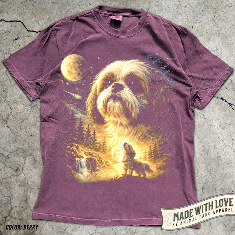 May include: Berry-colored t-shirt featuring a detailed illustration of a Shih Tzu dog with a celestial background. The design includes a moon, stars, and a forest scene with a waterfall. The text "MADE WITH LOVE" and "COLOR: BERRY" are also visible.