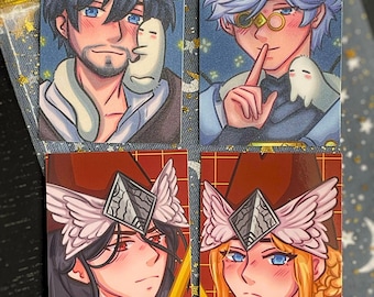 May include: Four rectangular art prints featuring stylized anime-inspired characters. The top two show individuals with a small white creature, while the bottom two depict figures wearing winged headpieces and holding yellow rods against a grid background.