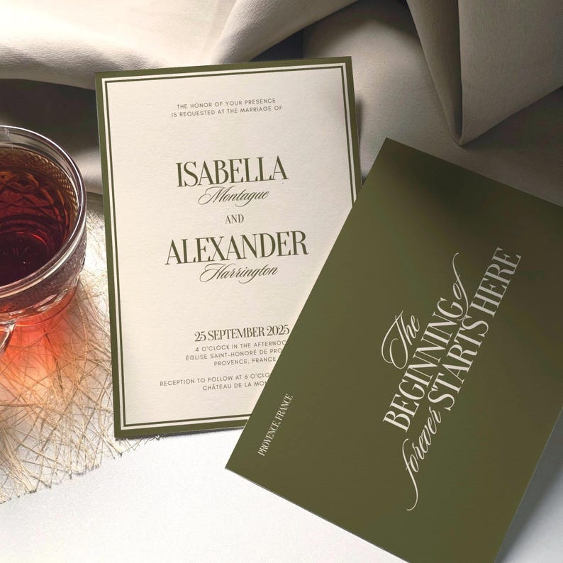 May include: A wedding invitation set featuring an off-white card with dark green borders and text reading Isabella Montague and Alexander Harrington, alongside a solid dark green card with the text The beginning forever starts here.