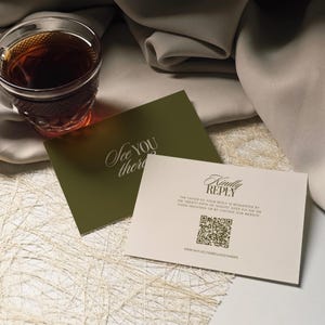 May include: Two rectangular cards with dark olive and cream backgrounds. The olive card reads "See YOU there". The cream card features "Kindly REPLY", text requesting a response by August 25th, a QR code, and the website URL sayido.isabellaalexander.