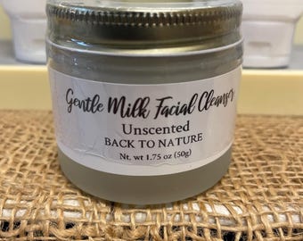 May include: A glass jar with a silver lid containing Gentle Milk Facial Cleanser, Unscented, Back to Nature, Net. wt 1.75 oz (50g).