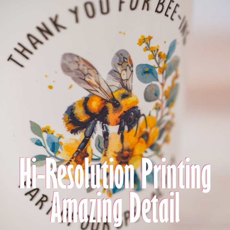 Image showcasing a personalized plastic stadium cup with a detailed bee design and the text 'Thank You for Bee-ing Here.' Highlights high-resolution printing and amazing detail, perfect for custom gifts and party favors
