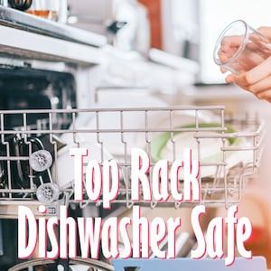 May include: A close-up of a dishwasher with a glass on the top rack. The text "Top Rack Dishwasher Safe" is superimposed on the image.