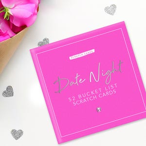 May include: Pink box with silver text that reads "Date Night 52 Bucket List Scratch Cards".