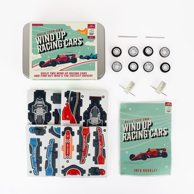 May include: A kit to build wind-up racing cars. The kit includes a metal tin with the words "Build Your Own Wind Up Racing Cars", car parts, wheels, axles, and an info booklet. The car parts are red, blue, black, and orange.