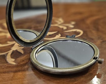 Antique Golden Pocket Mirror: Ornate Vintage Design, 2.75" Diameter