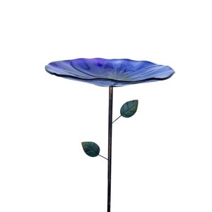 A blue bird bath with two green leaves attached to it, standing alone against a white background.