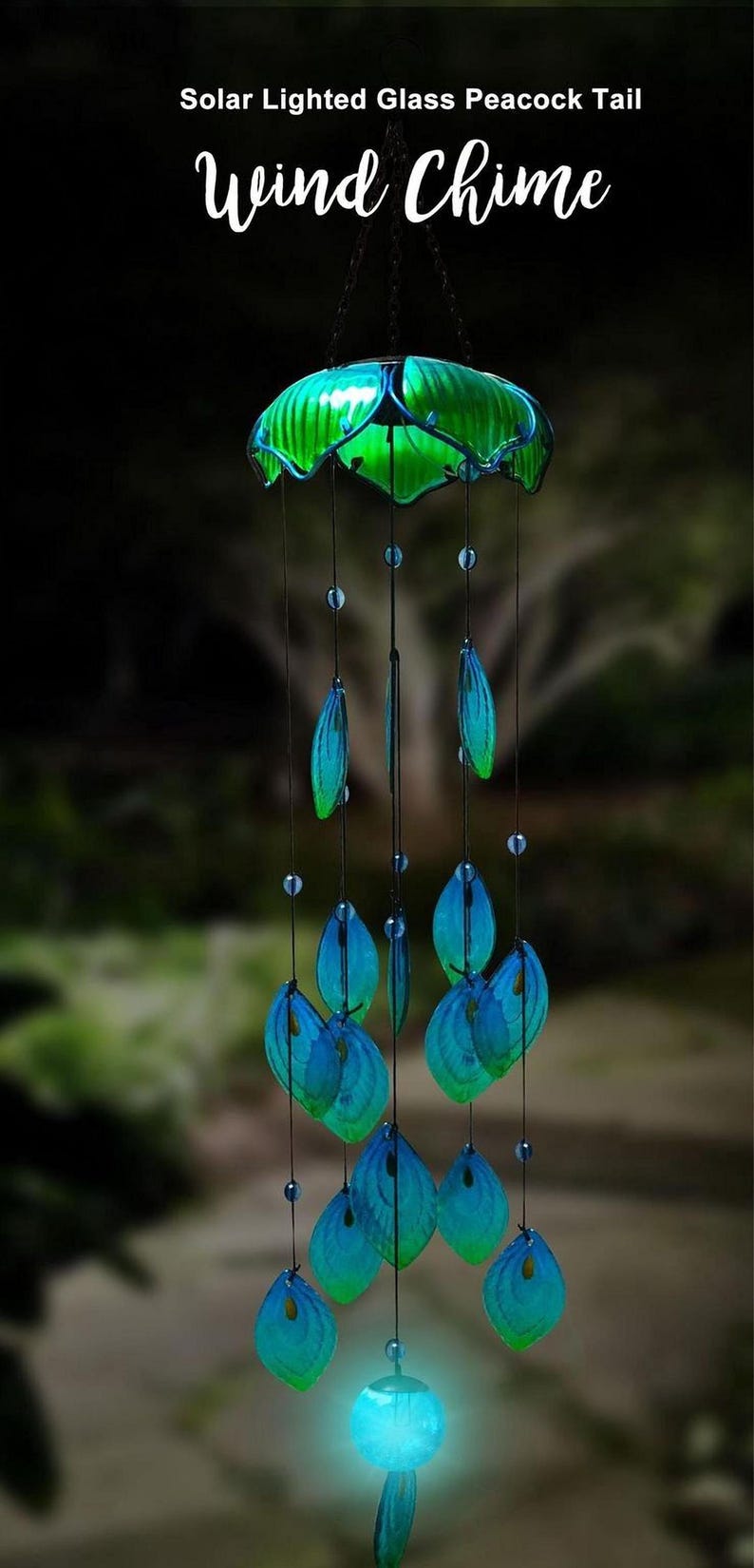 A solar-lit glass peacock tail wind chime with blue and green glass elements and a glowing blue ball at the bottom.