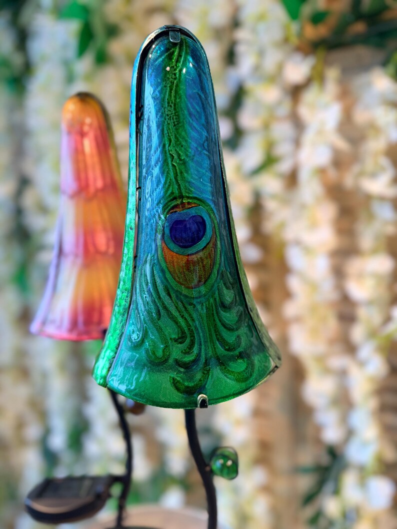 a close-up of a colorful, ornate lamp with a peacock feather design.