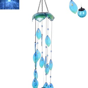 a wind chime with blue glass elements hanging from a metal hook.