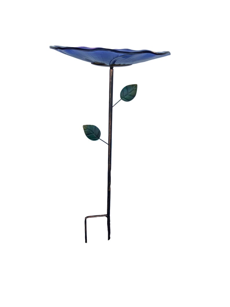 A blue bird bath with two green leaves attached to the side, standing on a metal stand.