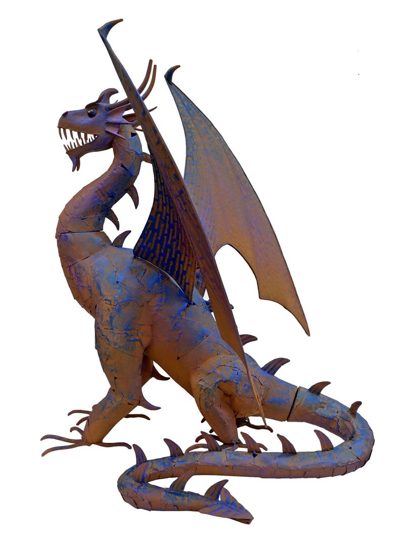 A metal dragon sculpture with a fierce expression and outstretched wings.