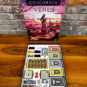 Organiseur Concordia Venus. Convient aux pochettes Salsa Expansion et Premium. Peut contenir une carte supplémentaire.
