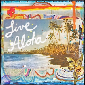 May include: A mixed media artwork featuring a vintage postcard with a beach scene and palm trees. The postcard has the text "Live Aloha" written on it in white paint. The artwork is framed with colorful painted stripes and a butterfly.
