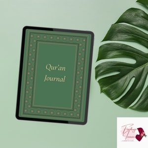 May include: A green tablet screen displaying a digital journal cover with the text "Quran Journal" in gold lettering. The cover has a decorative border with pink and green floral patterns. The tablet is on a light green background with a large green leaf in the upper right corner.