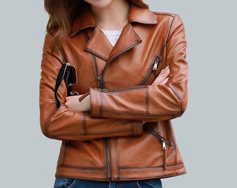 May include: A brown leather jacket with a zipper closure and a stand-up collar. The jacket has a distressed look and features multiple pockets.