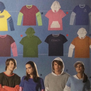 May include: A Burda Young Fashion sewing pattern packet, featuring shirt and t-shirt designs. The cover displays various shirt styles, including hooded and layered looks, with the number 7916 in a green starburst. The packet includes the text "easy".