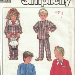 May include: Simplicity sewing pattern for children's pyjamas. The pattern includes four designs: a red and white plaid pyjama set with a ruffled collar, a blue robe with a belt, a red robe with a white bow, and a plaid pyjama set with a white collar.