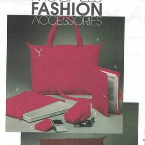 May include: A sewing pattern for a set of pink and brown accessories, including a tote bag, laptop sleeve, and small pouch. The pattern is from McCall's Fashion Accessories and is size OSZ. The pattern number is M6091.