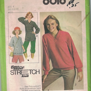 May include: Simplicity sewing pattern number 8618 for a knit top with a V-neck. The pattern is for sizes 8, 10, 12 and is a time saver stretch knit pattern.