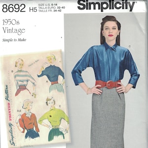 May include: Simplicity sewing pattern number 8692, size US 6-14, Euro 32-40, French 34-42, for a 1950s vintage skirt and blouse. The pattern includes instructions for making a skirt with a high waist and a blouse with a collar and long sleeves. The model is wearing a blue blouse with a red belt and a gray skirt.