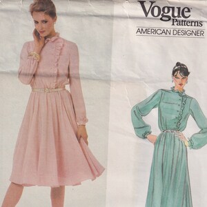 May include: Vogue Patterns American Designer sewing pattern for a dress with a ruffled neckline and long sleeves. The pattern is by Jerry Silverman and the pattern number is 2782.