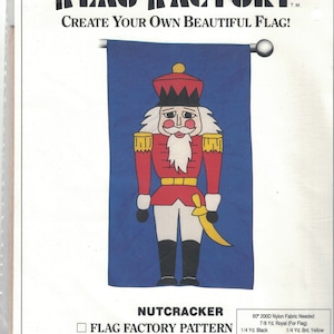May include: Nutcracker flag pattern sewing project. The pattern includes instructions for a 28 by 49 inch flag. The pattern features a red and black nutcracker illustration. The pattern is from The Flag Factory, a division of Mutual Industries.