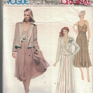 May include: A vintage sewing pattern featuring three women's dress designs. The pattern is for a long, flowing dress with a wrap skirt and a matching jacket. The pattern is by Gianni Versace for Jenny.