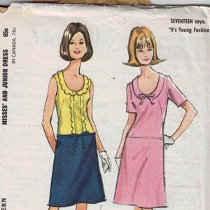 May include: A vintage sewing pattern for a dress, featuring two models wearing different styles of the dress. The pattern is McCall's 7709 and is for misses' and junior sizes. The text "SEVENTEEN says: "It's Young Fashion!" is printed on the pattern.