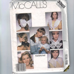 May include: McCall's sewing pattern number 3205 for a collar with a lace trim. The pattern includes instructions for making a collar with a lace trim. The pattern is by Marti Mitchell.
