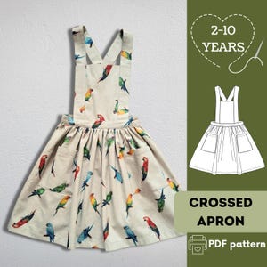 Ruffled School Apron Sewing Pattern: Cross Back, Pockets (PDF Download, Sizes 2-10 Years). Pattern in English language.