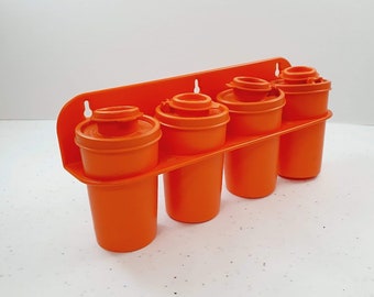 Tupperware Retro Orange Kitchen 1970's early plastic set of four Spice Canisters with wall bracket Caravan