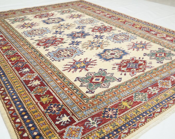 Handmade Afghan Kazak Wool Rug – 5.5x7.7 Beige Geometric Area Rug