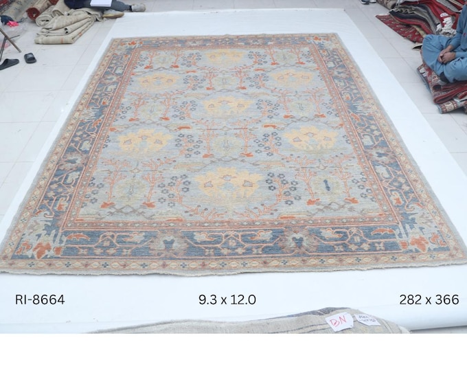 Hand-knotted Oshak Wool Rug Floral  in Blue base and Blue border, 9.3 x 12.0 ft