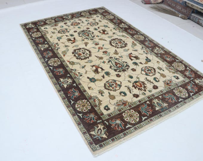 Hand-knotted Chobi Cotton and Wool Rug, Floral in Beige base and Brown border, 5.1 x 8.1 ft