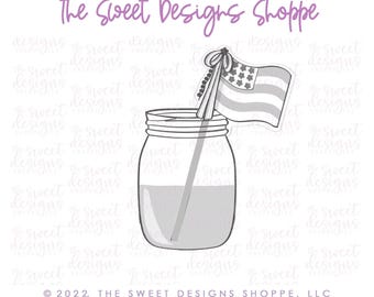May include: A mason jar with a straw and a small American flag on top. The jar is filled with a light gray liquid. The flag is gray and white with stars and stripes.