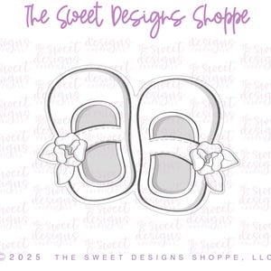 May include: A digital design file for a pair of white baby shoes with a flower detail. The design is for use with a cutting machine.