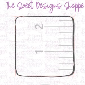 May include: A black and white ruler with markings for 1 and 2 inches. The ruler is outlined in black and has a rounded edge.