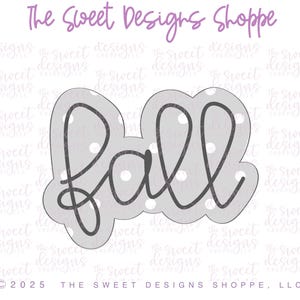 May include: A gray cookie cutter in the shape of the word "Fall" in a cursive font. The word is outlined in black and filled with white polka dots. The text "The Sweet Designs Shoppe" is above the cookie cutter.