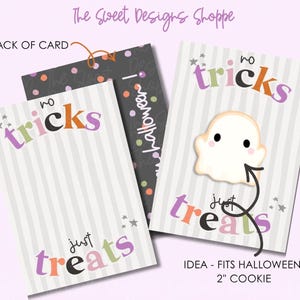 May include: Two rectangular cards with light gray vertical stripes and the text no tricks just treats in purple, orange, and black. One card features a white ghost cookie with black eyes and pink cheeks. The back of the card is dark gray with colorful dots.