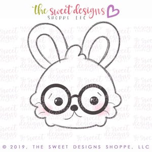 May include: A black and white line drawing of a bunny wearing glasses. The bunny has large ears and a fluffy face. The bunny is looking to the right.