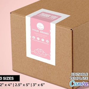 Puede incluir: Una etiqueta de agradecimiento rosa y blanca para un paquete. La etiqueta tiene un logotipo, el texto "Your Brand", iconos de redes sociales y el texto "A joyful package just for you". La etiqueta está en una caja de cartón marrón. El texto "Thank you for your purchase" está en la parte superior de la etiqueta. La etiqueta está disponible en tres tamaños: 5 x 10 cm, 6.5 x 13 cm y 8 x 15 cm.