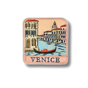 May include: A square embroidered patch featuring a scene of Venice with a red gondola on blue water, surrounded by multi-colored buildings in shades of yellow, pink, and white. The word VENICE is stitched in dark blue capital letters at the bottom.