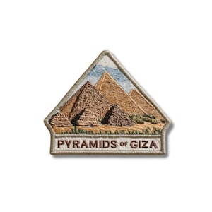 May include: A pentagonal embroidered patch featuring a detailed scene of the Pyramids of Giza in shades of tan, brown, and blue. The bottom section contains a white rectangular border with the text PYRAMIDS OF GIZA stitched in dark brown thread.